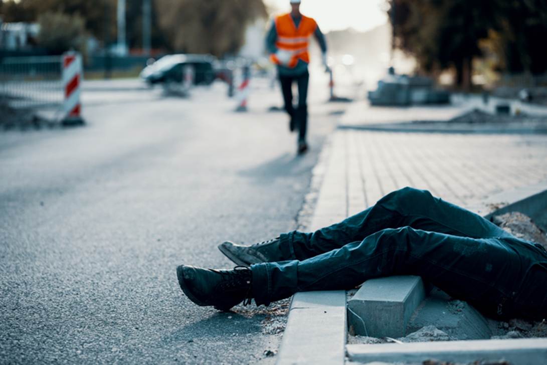 A person lying on the side of the road
AI-generated content may be incorrect.